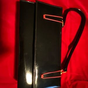 Vintage patent leather handbag with red leather accents